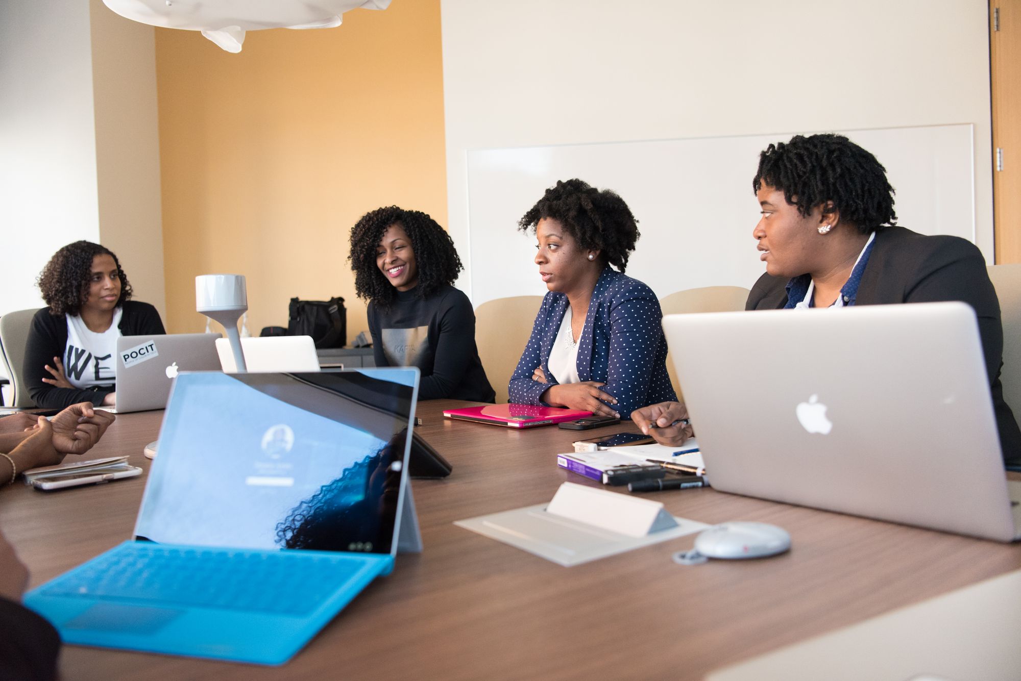 A team collaborating on laptops in a modern office